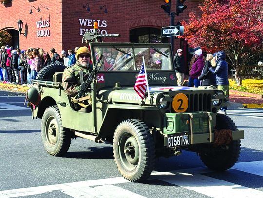 ANTIQUE military vehicles joined in the Veterans Day parade Tuesday