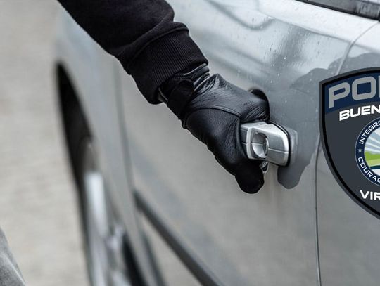 Close image of a gray car door, a thief with a gloved hand gripping the handle. The Buena Vista Police Department logo sits in the right side of the photo.