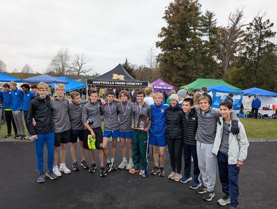 The Rockbridge County High School boys cross country team celebrates with its runner-up trophy at the Region 3C meet in Palmyra. (Lucy Lyons photo)