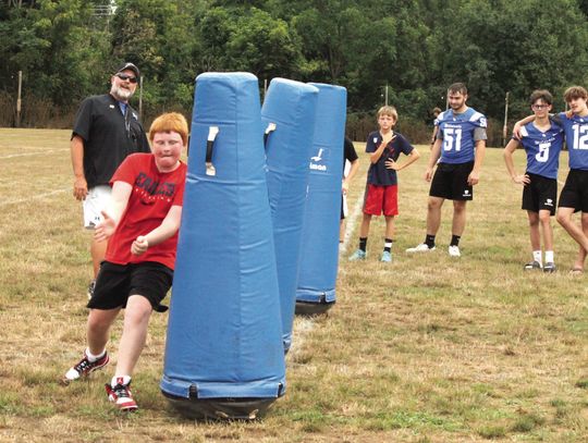 Wildcats Teach Youths Football Skills