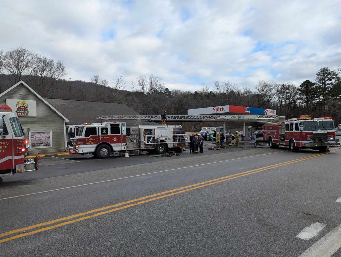 Three fire trucks outside of the Natural Bridge Country Store. The first firetruck is from Buchanan, the middle from Glasgow, and the third from Buena Vista.