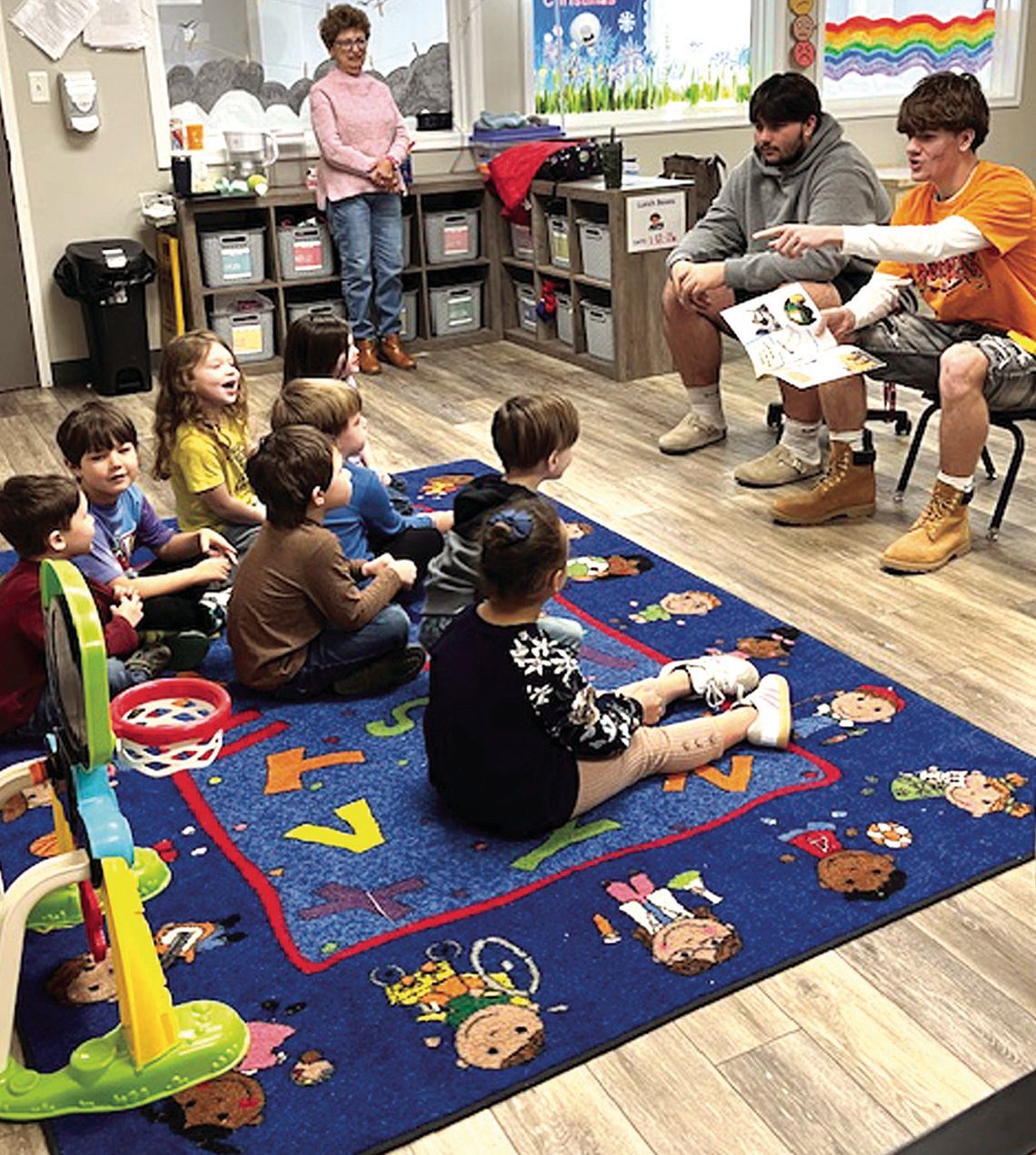 RC Boys Basketball Players Visit YMCA Youth Center