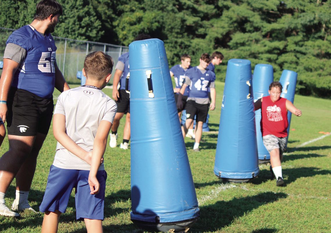 Wildcats Teach Football Skills To Youths